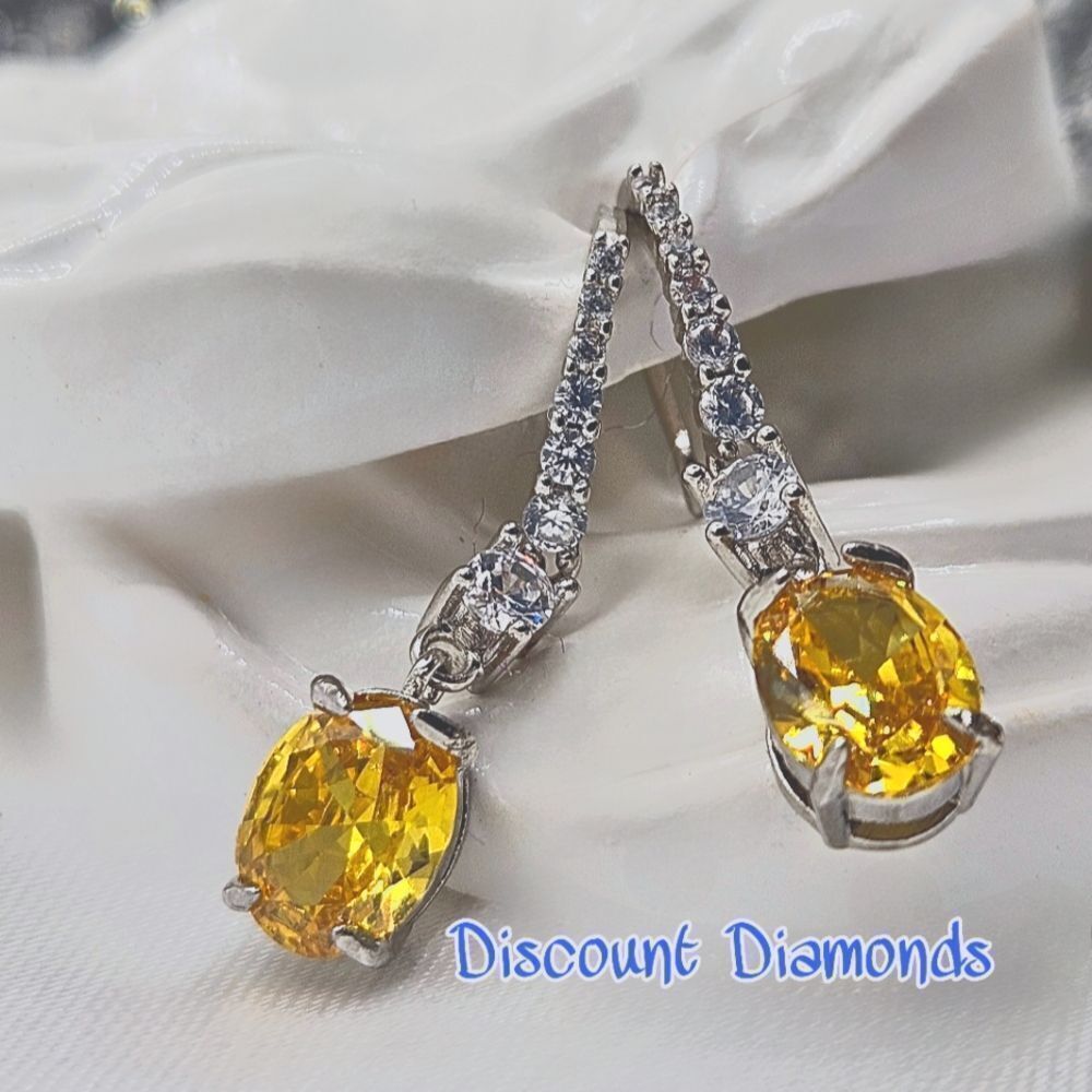 Oval Cut Yellow Diamond Earrings with Clear White Baguette Diamonds 925…